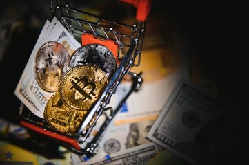 Bitcoin on background of US dollars, euro banknotes. Electronic decentralized money, exchange rate and growth of crypto currency