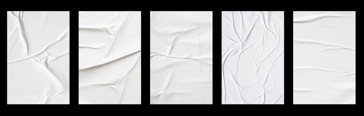 white crumpled and creased glued paper poster set isolated on black background