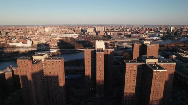Harlem River Houses, NYC. Yankee Stadium in background. 4K drone shot.