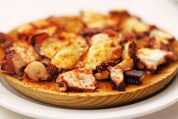 Octopus dish prepared in the style of Galicia (pulpo a feira). Spanish tapas. Selective focus