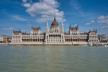 Obraz premium A gothic-designed Hungarian Parliament building on the Danube's bank in Budapest, Hungary