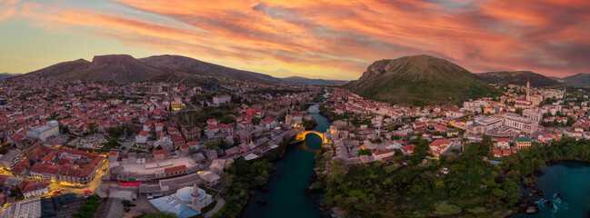 Aerial view of city of Mostar in Bosnia and Herzegovina and it's landmarks (Neretva river, Old...