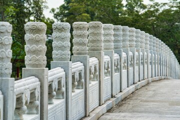 Scenic view of traditional Chinese marble pillars on a bridge