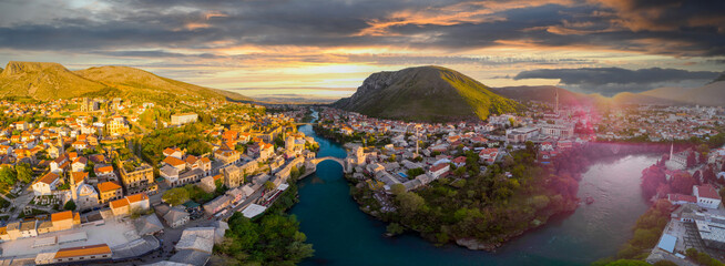Aerial view of city of Mostar in Bosnia and Herzegovina and it's landmarks (Neretva river, Old...