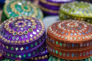 Closeup shot of colorful jewelry boxes with shiny decorations in a store