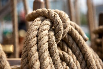Fototapeta premium Strong ropes for sailing hanging on a wooden pole