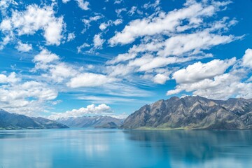 Fototapeta na wymiar Aerial view of lake surrounded by mountains