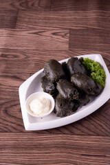 vegan deep fried crispy black charcoal beancurd tofu with salad tartar creamy white sauce vegetable on wood table asian chinese appetiser snack banquet halal food menu for restaurant gourmet buffet, 