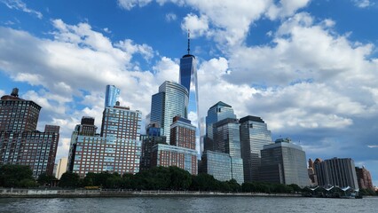 Fototapeta na wymiar Modern buidlings and the One World Trade Center along the Hudson river in New York City, USA
