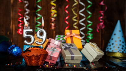 Birthday background with muffin and candles with number  59. Beautiful anniversary background with...