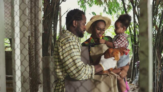 Happy farmer African family on livestock farm