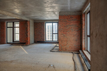 Repair and restoration of apartments. Red brick walls, concrete floors.