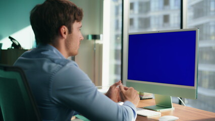 Unknown employee talking blue screen monitor closeup. Ceo gesturing video chat