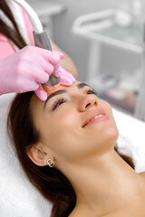 Cosmetology service,Facial treatment,esthetic procedure,Rejuvenation treatment. cosmetologist is administering a cosmetic facial procedure to a female client