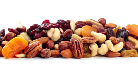 Fototapeta na wymiar Mix of nuts and dried fruits isolated on a white background.