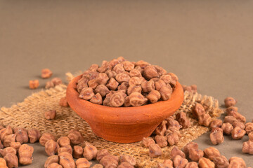 Black Chickpeas or Kala Chana with chana dal pulse isolated on wooden Background.