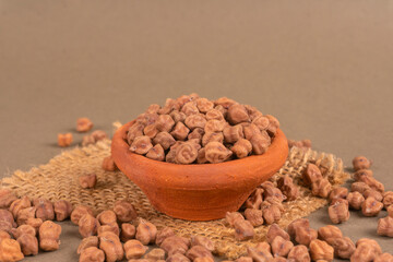 Black Chickpeas or Kala Chana with chana dal pulse isolated on wooden Background.