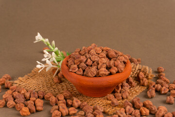 Black Chickpeas or Kala Chana with chana dal pulse isolated on wooden Background.