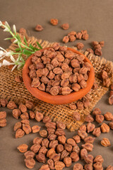 Black Chickpeas or Kala Chana with chana dal pulse isolated on wooden Background.