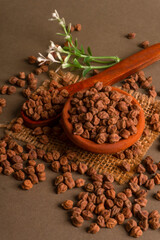 Black Chickpeas or Kala Chana with chana dal pulse isolated on wooden Background.
