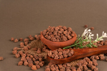 Black Chickpeas or Kala Chana with chana dal pulse isolated on wooden Background.