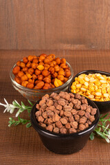 Black Chickpeas or Kala Chana with chana dal pulse isolated on wooden Background.