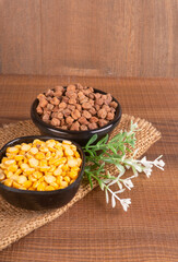 Black Chickpeas or Kala Chana with chana dal pulse isolated on wooden Background.