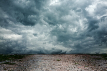 Fototapeta na wymiar dramatic sky and dry ground 