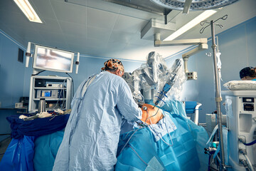 Surgical system with minimally invasive robot in a hospital. Robotic technological equipment,...