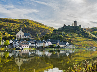 Beilstein village and its reflection on Moselle river during autumn seasn in Cochem-Zell district, Germany