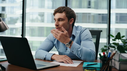 Obraz premium Man saying goodbye video call sending air kiss at office laptop close up.
