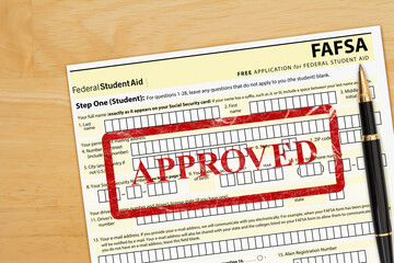 US federal Student Loan application form approved on a desk