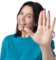 Smiling woman  raised her hand palm up and forward like waving.