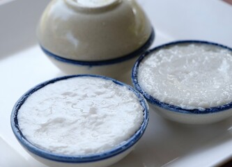coconut milk custard in small porcelain cup (Thai dessert).