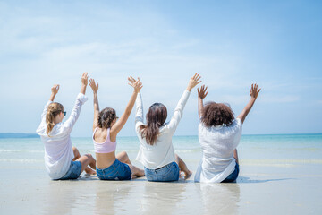 Group of happy friends having fun on beach summer holiday,Outdoors,Sunny vacation enjoying play time together.