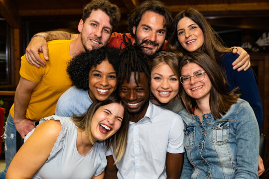 Diverse best friends taking selfie in face having fun together – multiracial young people smiling face taking photo – multicultural students live in Erasmus – millennials portrait having fun