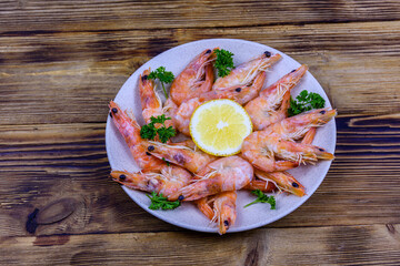 Shrimps with lemon and parsley on a plate