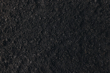 Soil texture dark gardening background