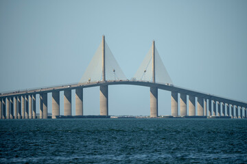 Sunshine Skyway Bridge over Tampa Bay in Florida with moving traffic. Concept of transportation infrastructure