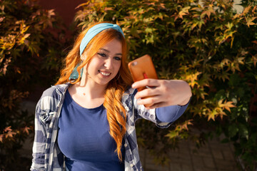 A young adult woman illuminated by the sun