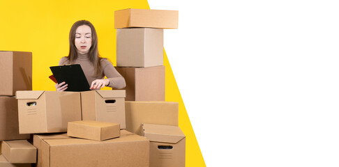 Businesswoman among boxes. Girl with cardboard parcels. Woman small business owner. Copy space on white. Businesswoman is engaged in fulfillment. Lady among cardboard boxes. Businesswoman portrait