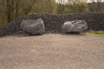 Roadblock dead end with rocks and gravel of a street