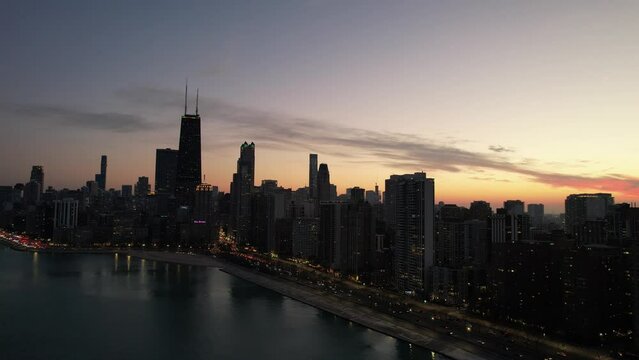 Sunset lakeshore moment during wintertime Chicago.The City of Chicago Skyline iconic view.