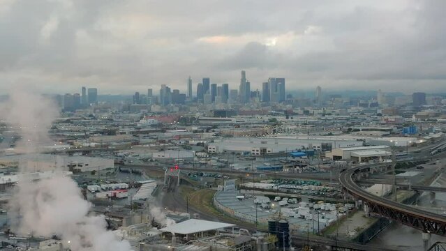 March 2023 - 4K aerial of full LA River on a stormy day in Downtown Los Angeles, California, USA.