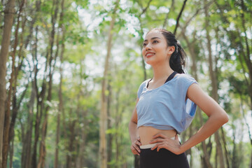 An Asian female is exploring the nature while running. Concept of recreation, Weekend break, discovery, positive energy, happiness, carefree, traveler, Alone and solitude, lifestyle activity freedom.