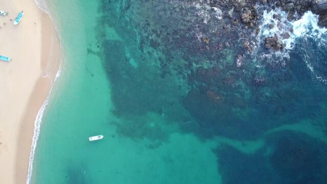 4k mexico drone video oaxaca huatulco summer destination nature travel in america, tropical oceanside boats in the water paceful beaches rocks and cliffs