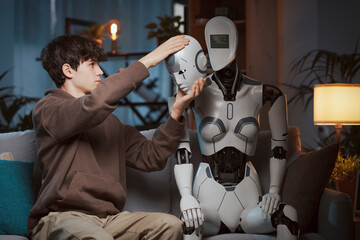 Teenager removing a robot head
