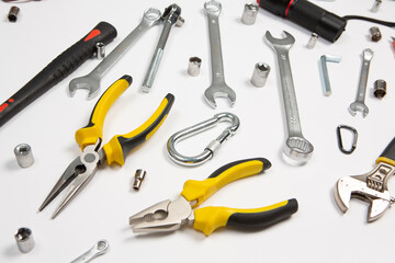 Set of tools for repair in a case on a white background. Assorted work or construction tools. Wrenches, Pliers, screwdriver. Top view