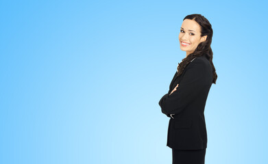Happy smiling attractive businesswoman, with copy space area for some slogan or advertising text....