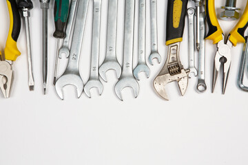 Set of tools for repair in a case on a white background. Assorted work or construction tools. Wrenches, Pliers, screwdriver. Top view